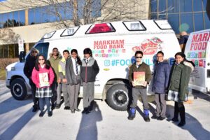 Elementary Student Activity Council student help the Markham Food Ambulance with donations